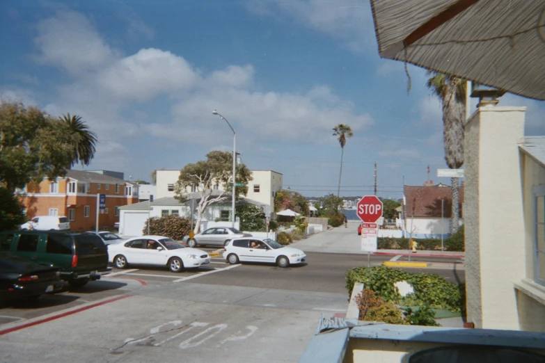 an intersection in an urban neighborhood on a sunny day