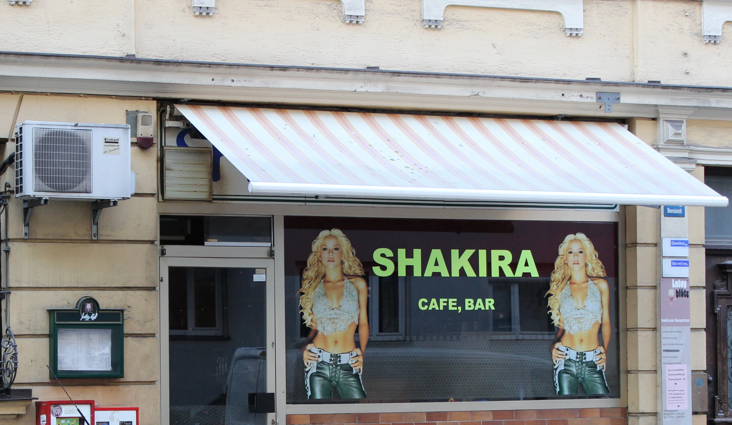 a shop with a sign that says shakir cafe bar
