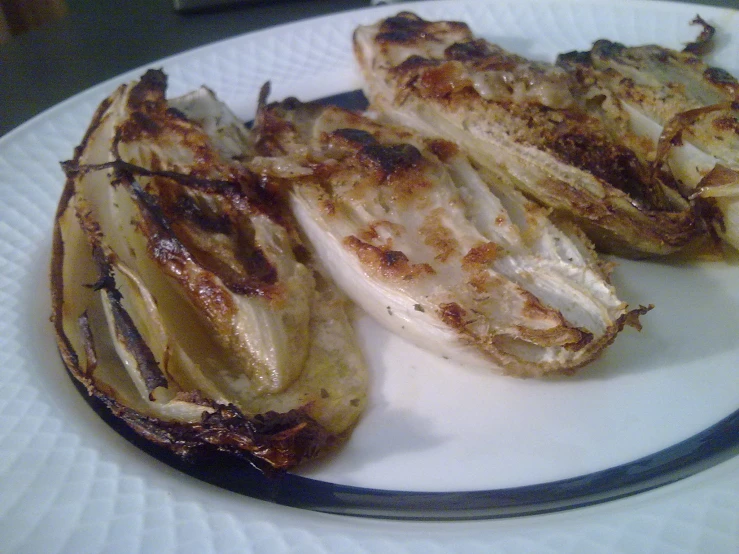 cooked items on white plate sitting on a table