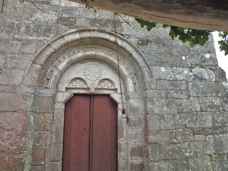 an old style arch over a wooden door