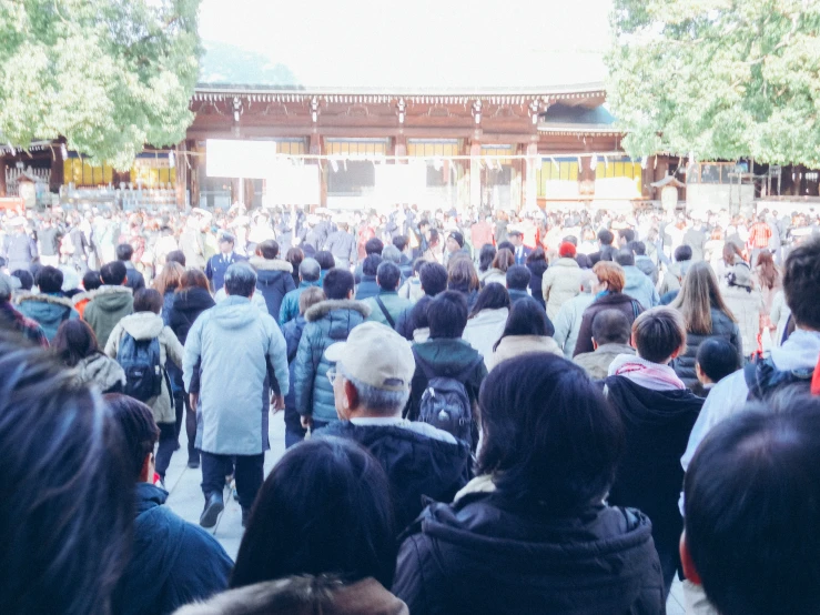 large group of people walking outside during the day