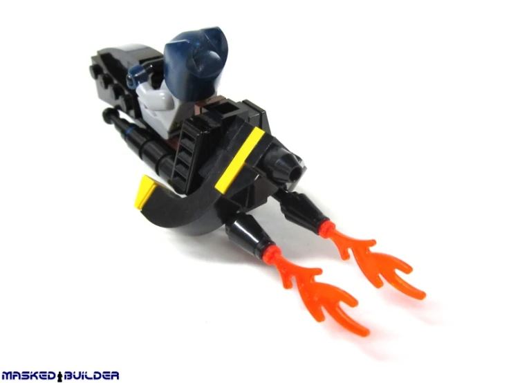 a lego figure is laying on the floor with orange arms