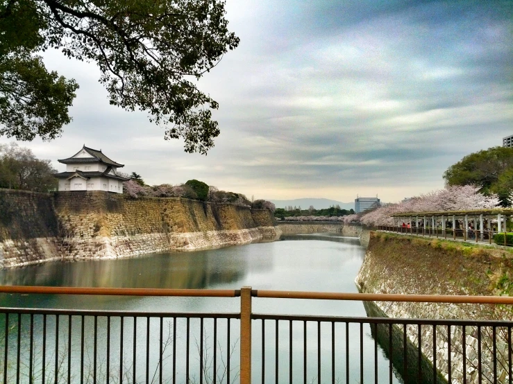 a view looking over a fence at some water