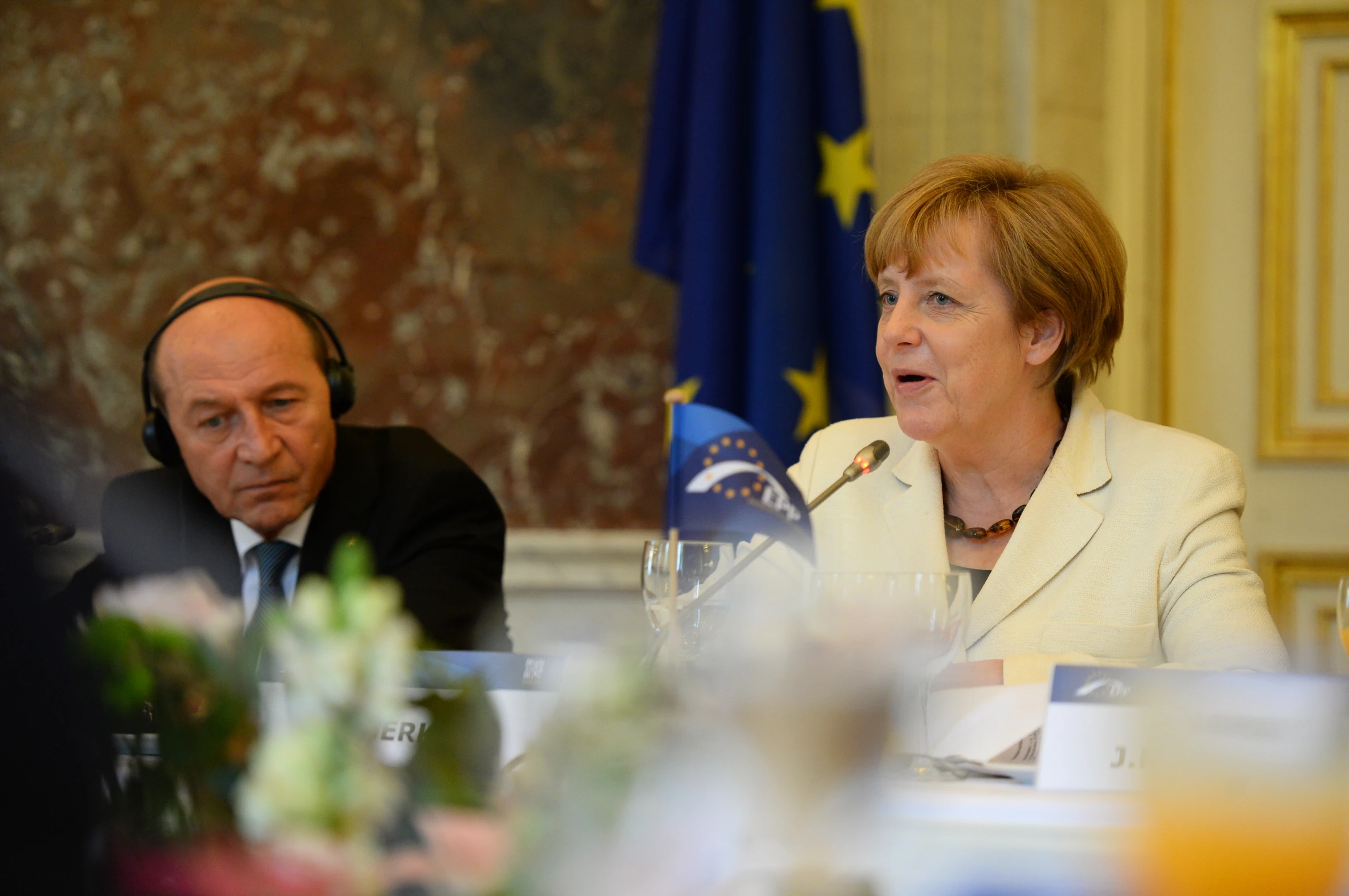 two business people sitting at a table talking