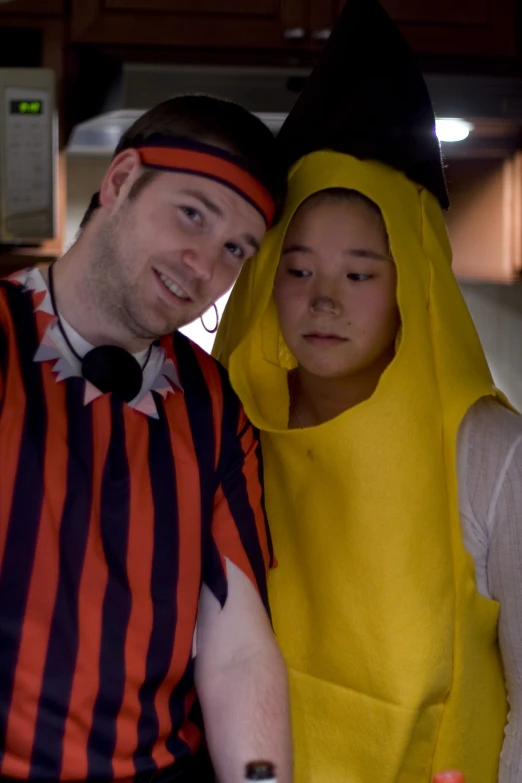 two people in costumes standing near each other