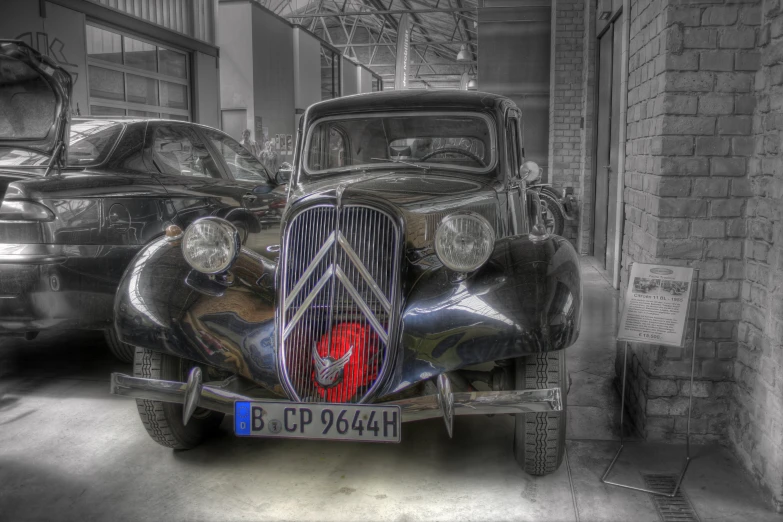 a vintage car with a red grill grille