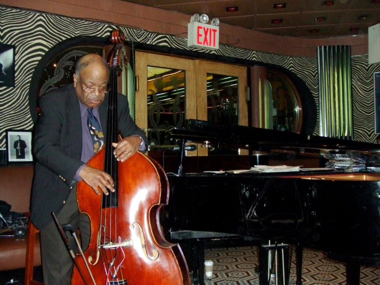 the man is playing his own music instrument in the lobby