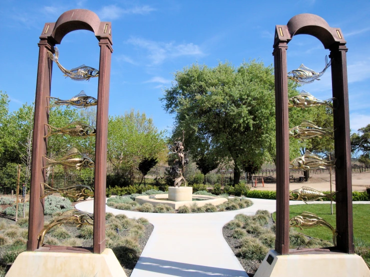 a stone pathway leads to two arches of archways