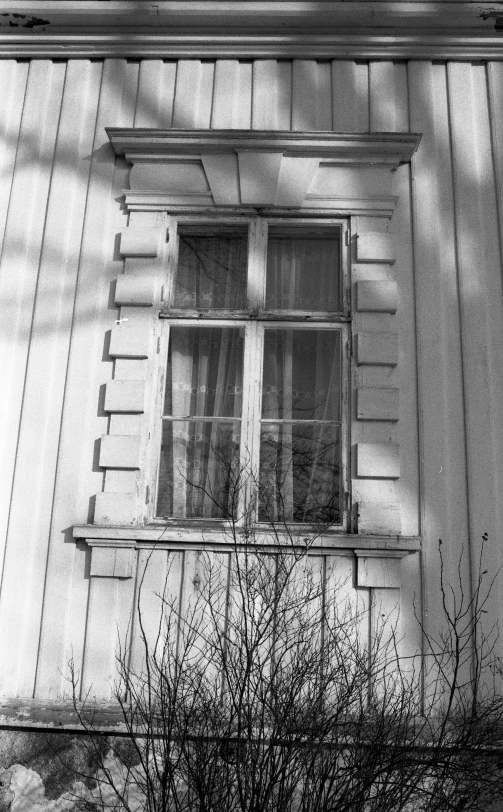 an old window on the side of a building