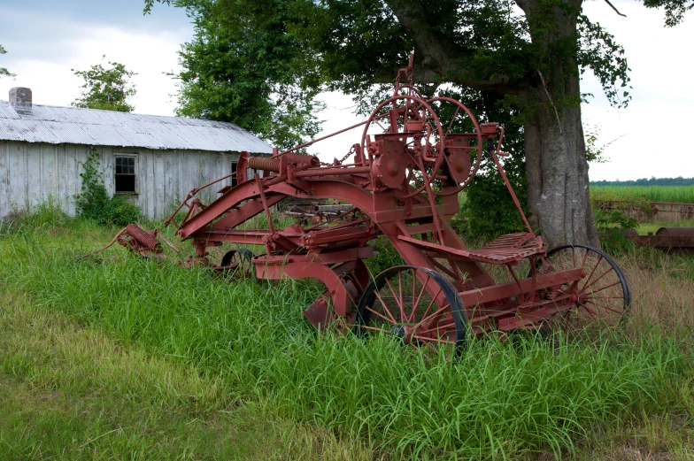 a group of farm machinery that have been rusted away