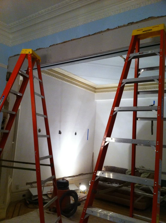 a very large room with several red ladders