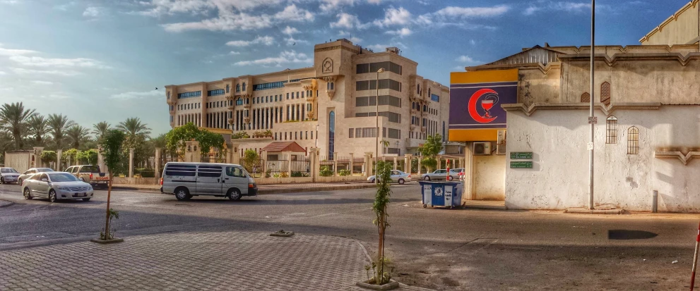 an old building stands next to the street of an urban area