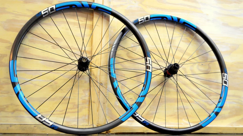 two disc wheels sitting side by side