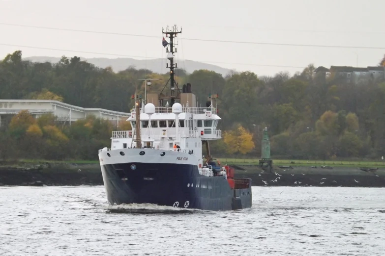 a large boat is traveling across the water