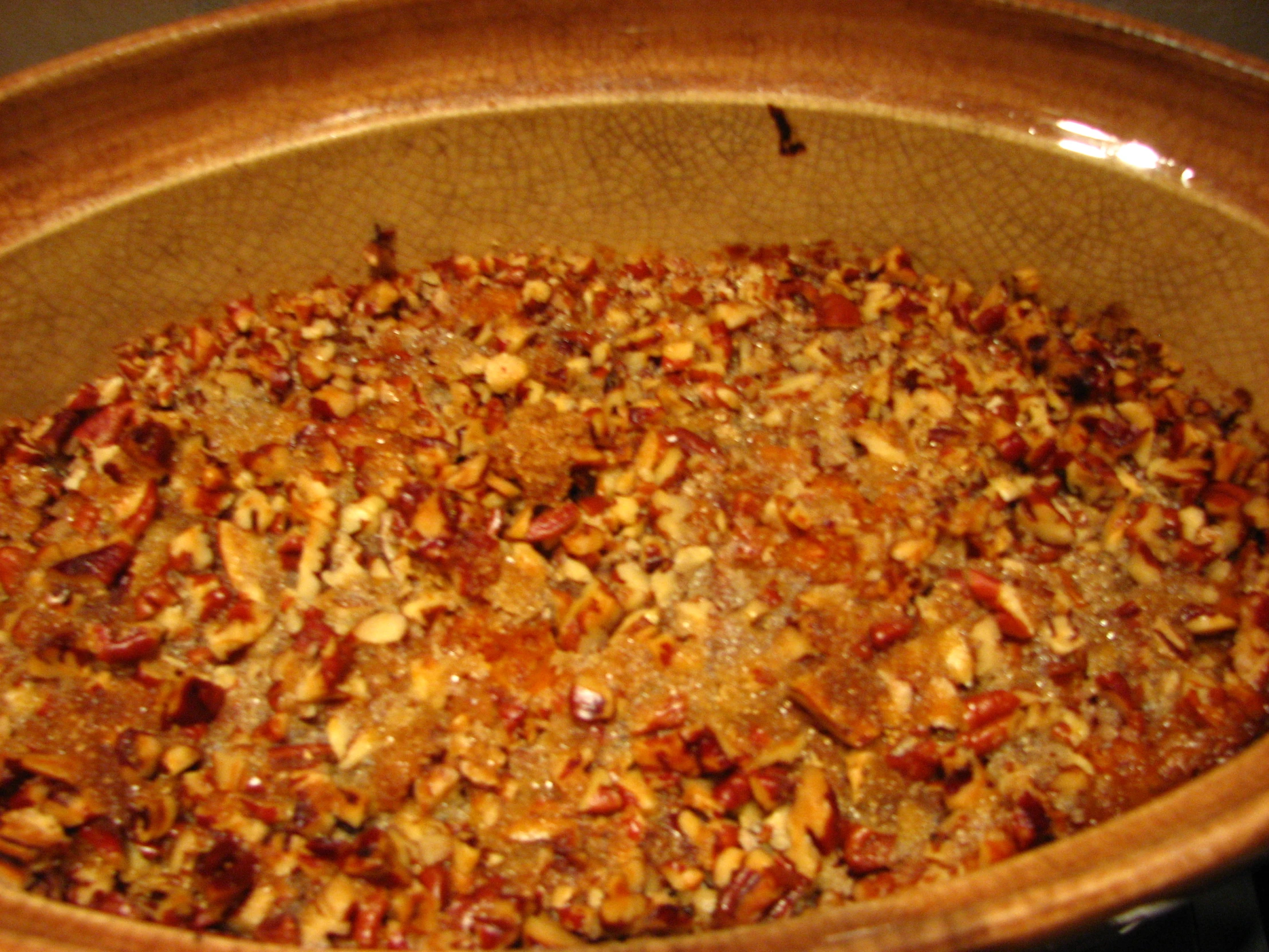 a serving dish covered in nuts and spices