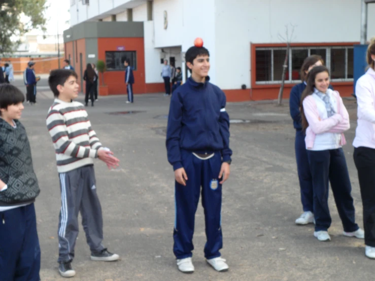 a group of young people standing around each other