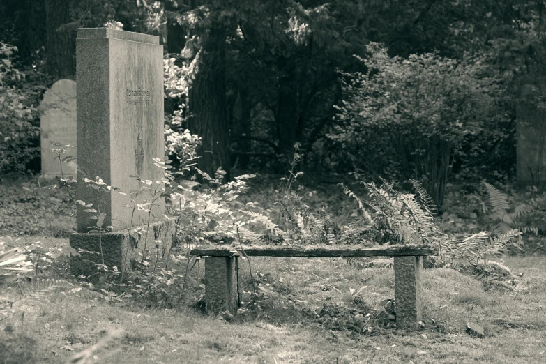 a black and white pograph of an old cemetery