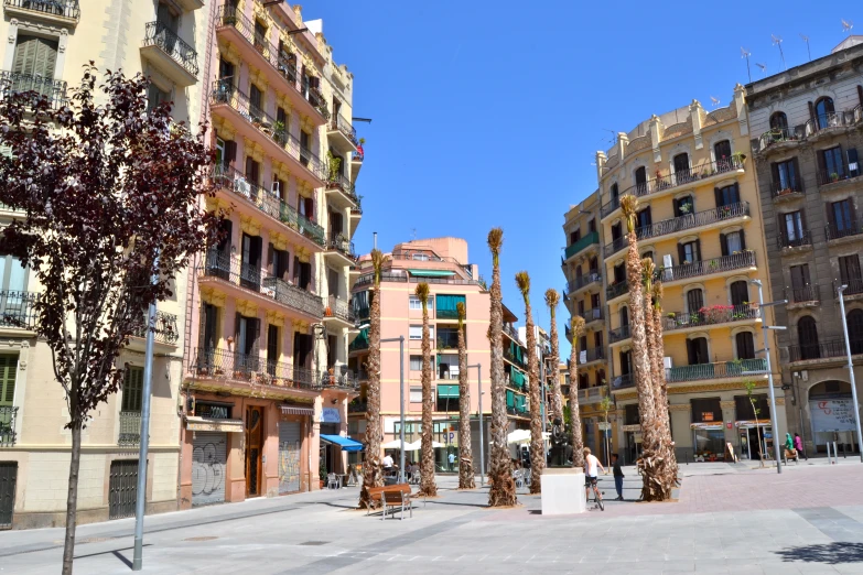 a street scene of two buildings in the middle of the day