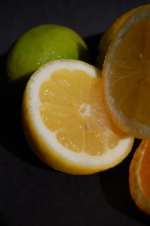 a group of sliced oranges with one cut in half