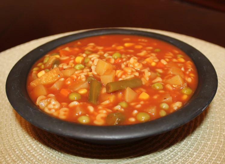 a bowl filled with soup sitting on top of a table