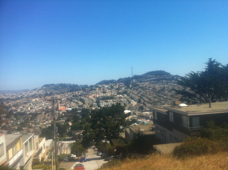 a distant po of a small town and trees