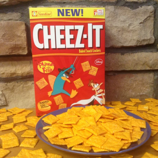 a plate of cheez it next to a bag of ers