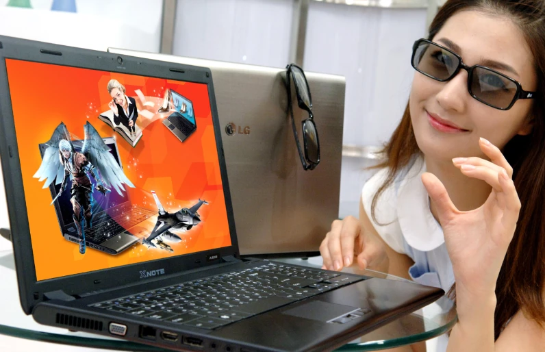 a woman in glasses is looking at the laptop