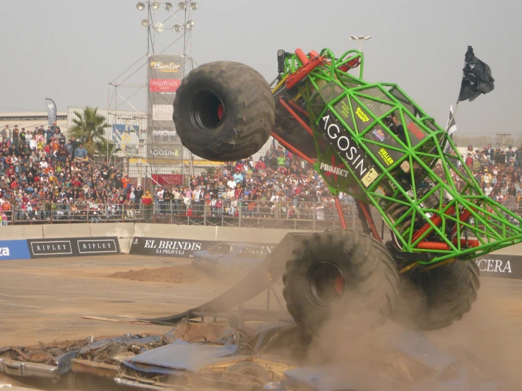 a monster truck with its front wheels in the air