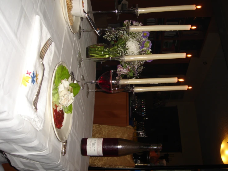 a table with several place settings for wine and cheese