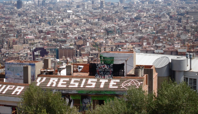 a cityscape with buildings on each side and lots of trees