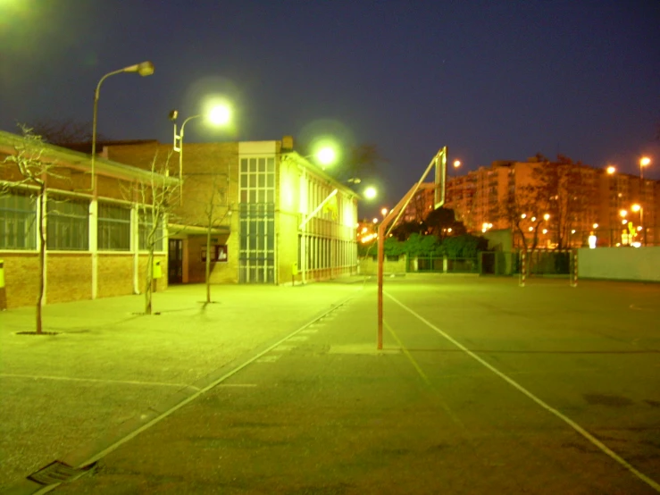 there is a large empty street at night