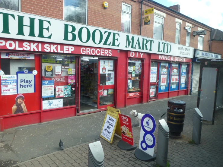 a storefront with various signage on the windows