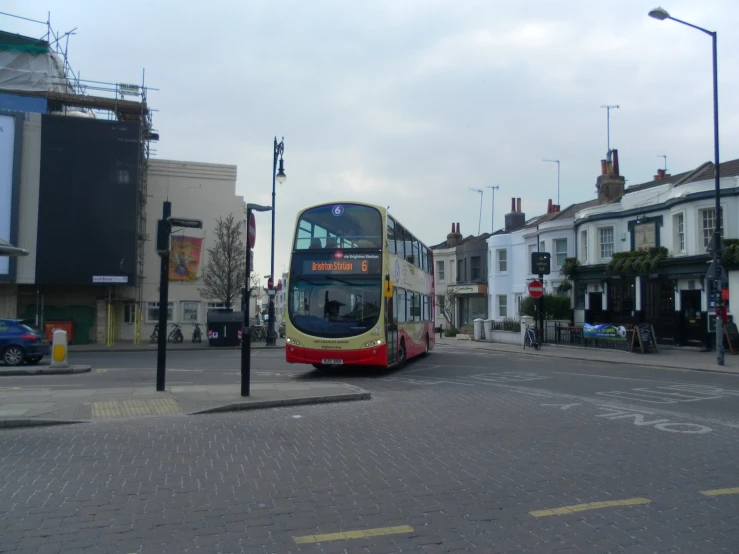 a double decker bus turning into a city
