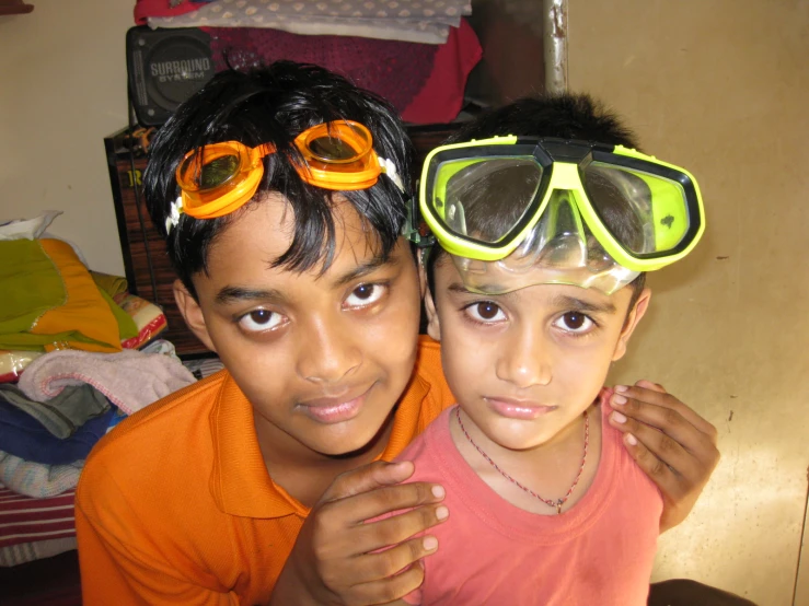 a boy and a girl who are wearing goggles