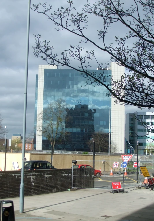 the outside of a tall building next to trees