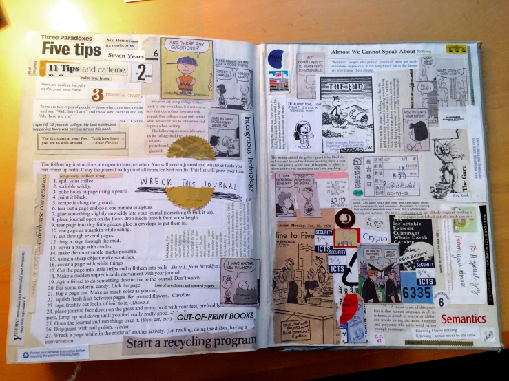 an open magazine with newspaper clippings and other paper