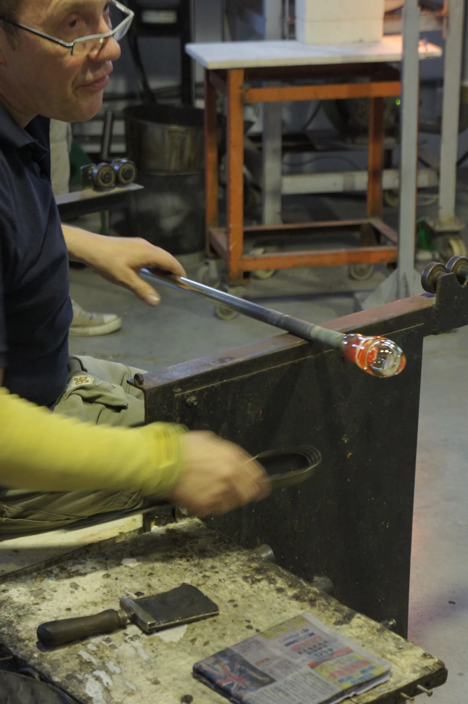 a man with safety goggles  soing on a table