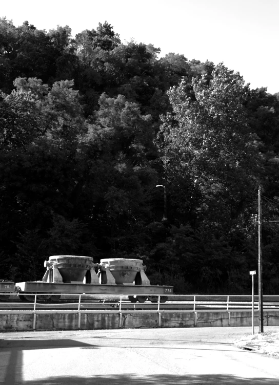 a couple of statues sitting in the middle of a road