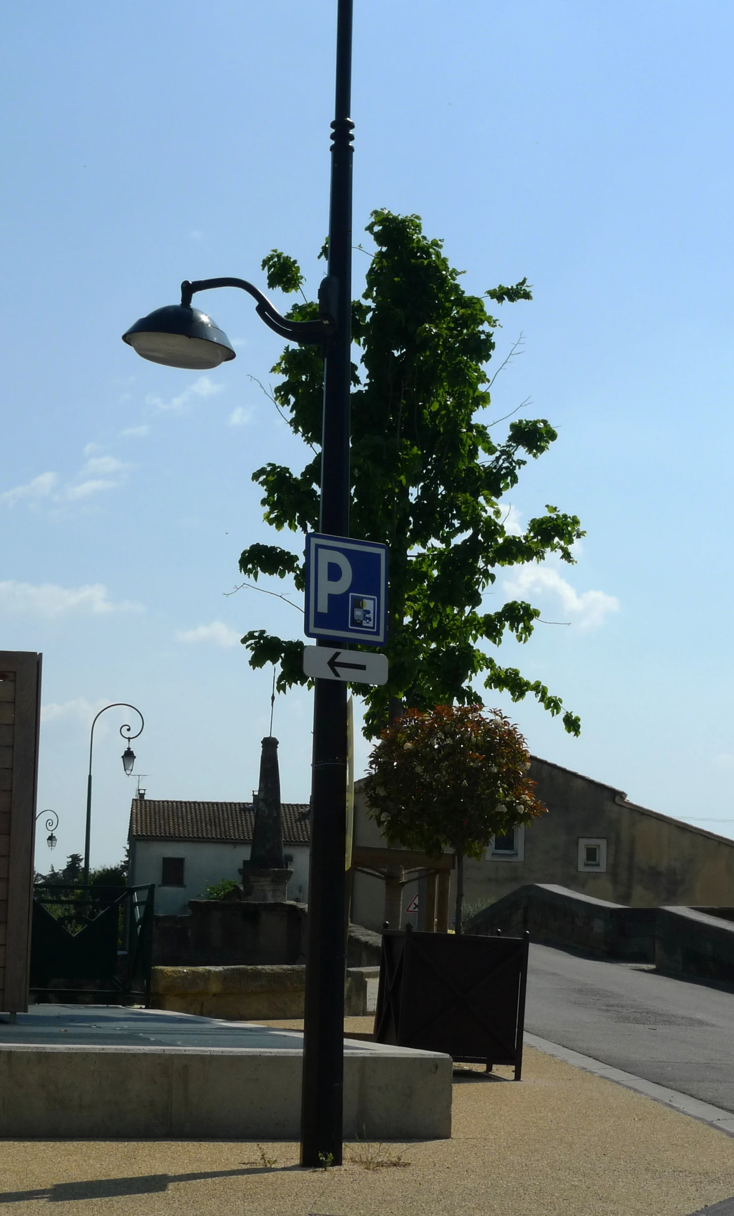 a picture of an empty street on a sunny day