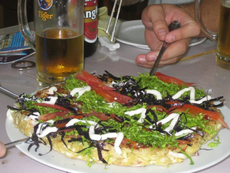 a person  soing off the bread with a fork