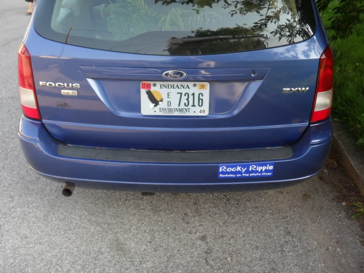 an image of the back of a blue toyota cr - v