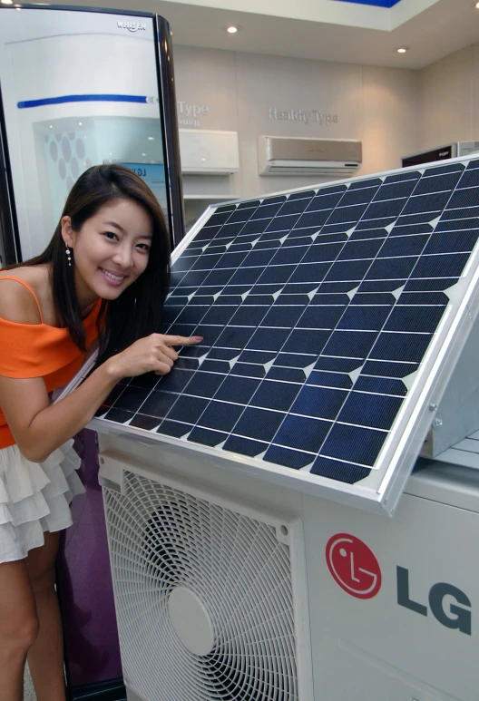 a beautiful lady in a red top by a rooftop mounted air conditioner