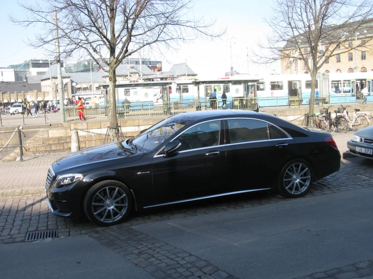 there is a black car parked on the street