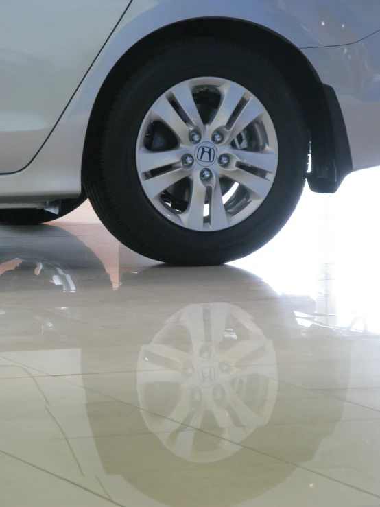 a car's tire in the front wheel of a vehicle