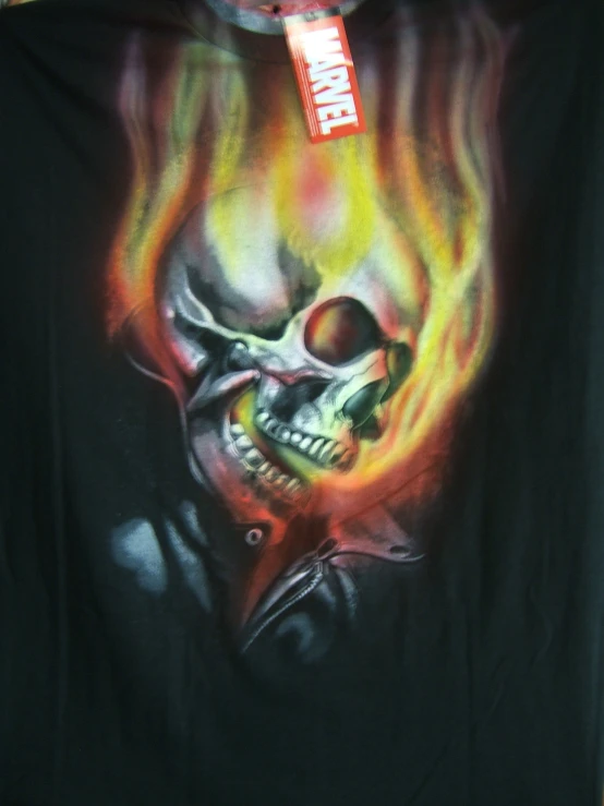 a fire skull shirt with flames coming out of it