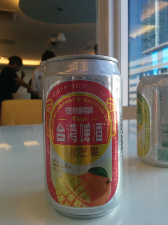 an empty can of tea sitting on a table