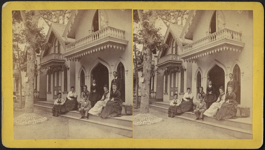 the old pograph shows people sitting on the steps