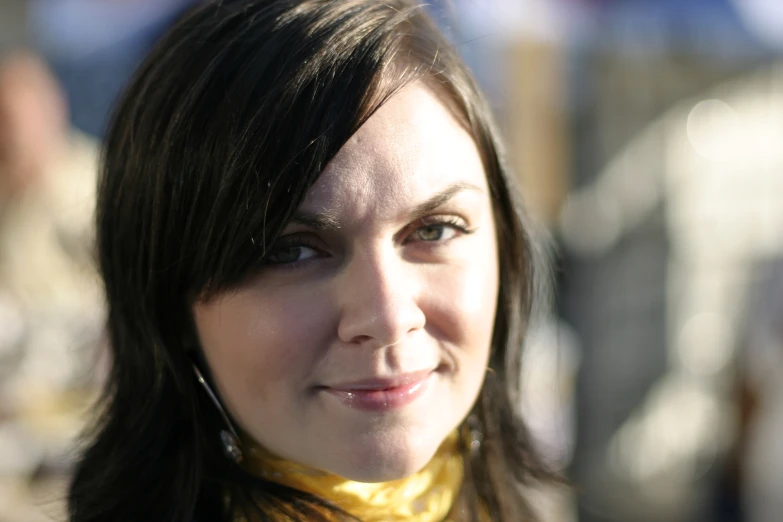 a close up of a young woman with a smile