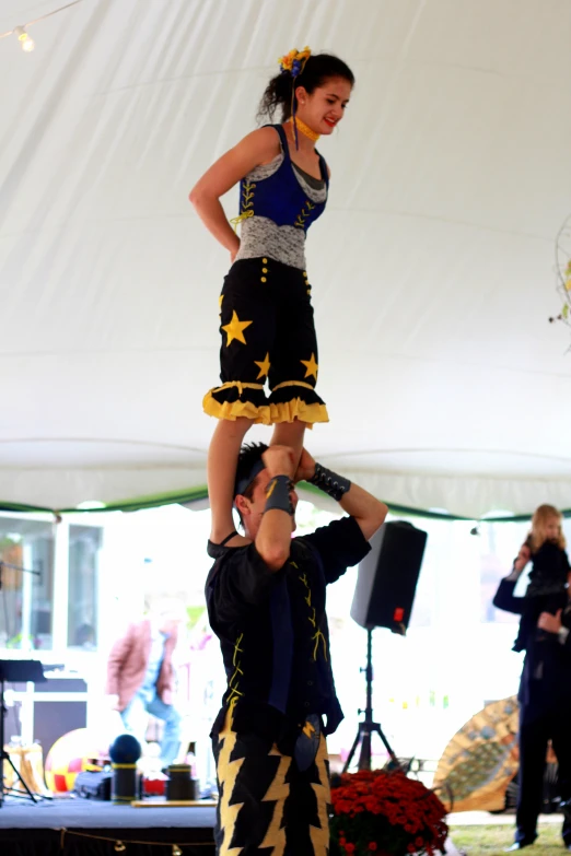 two performers with one holding on to the other's back