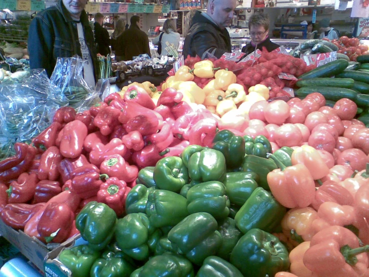 peppers in the vegetable section of a store